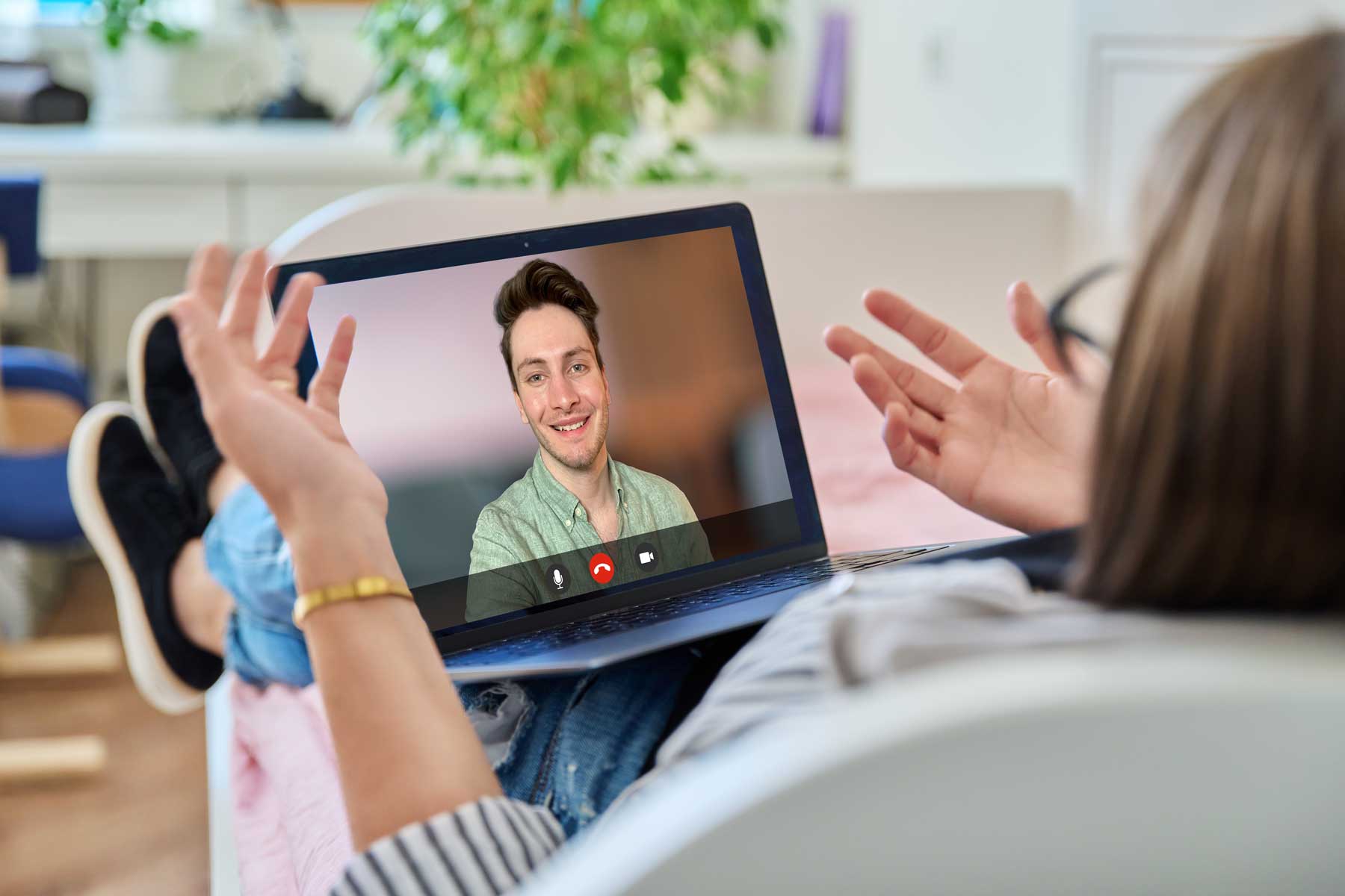 Person engaging in an online therapy session with a licensed therapist on a laptop, representing Mount North’s virtual counseling services.