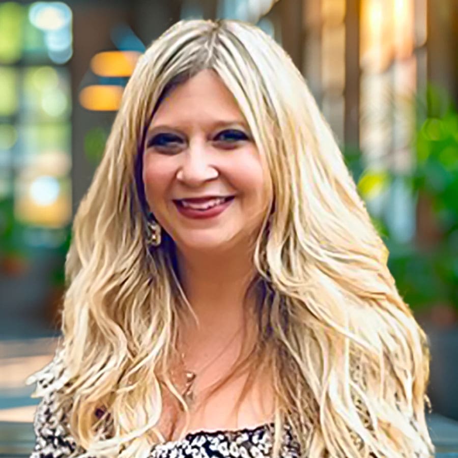 Justine Basile – School Counseling & Mental Health Specialist "Professional headshot of Justine Basile, M.Ed., NCC, a school counselor specializing in anxiety disorders, depression, mood disorders, and trauma recovery.